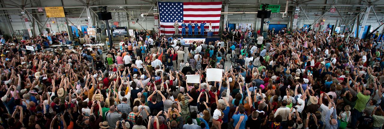 A large crowd of supporters welcomes home the crew of STS-135 during a ceremony for the crew of the space shuttle Atlantis, the final mission of the NASA shuttle program, at Ellington Field in Houston on Friday, July 22, 2011. ( NASA Photo / Houston Chronicle, Smiley N. Pool )