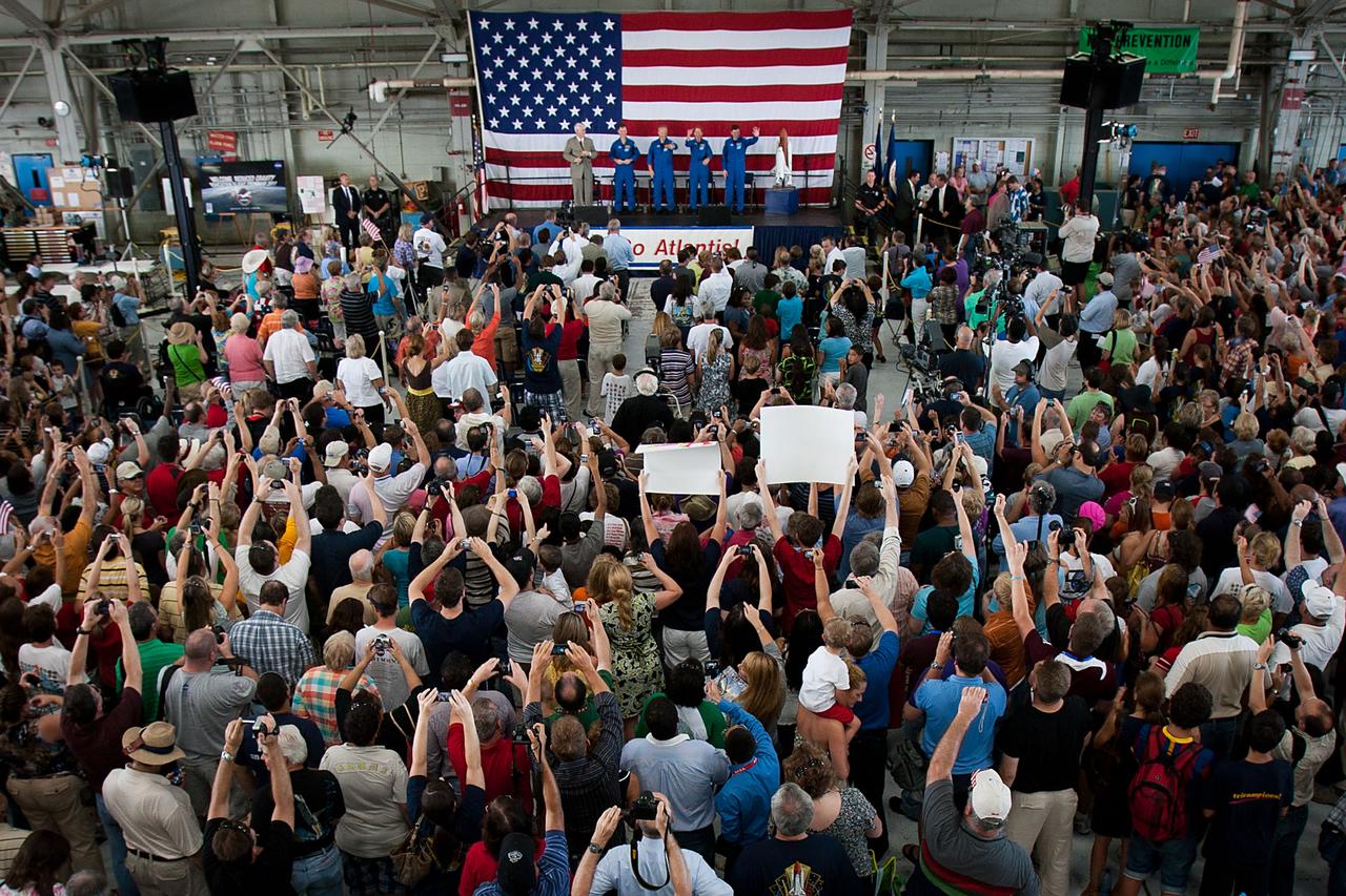 A large crowd of supporters welcomes home the crew of STS-135 during a ceremony for the crew of the space shuttle Atlantis, the final mission of the NASA shuttle program, at Ellington Field in Houston on Friday, July 22, 2011. ( NASA Photo / Houston Chronicle, Smiley N. Pool )
