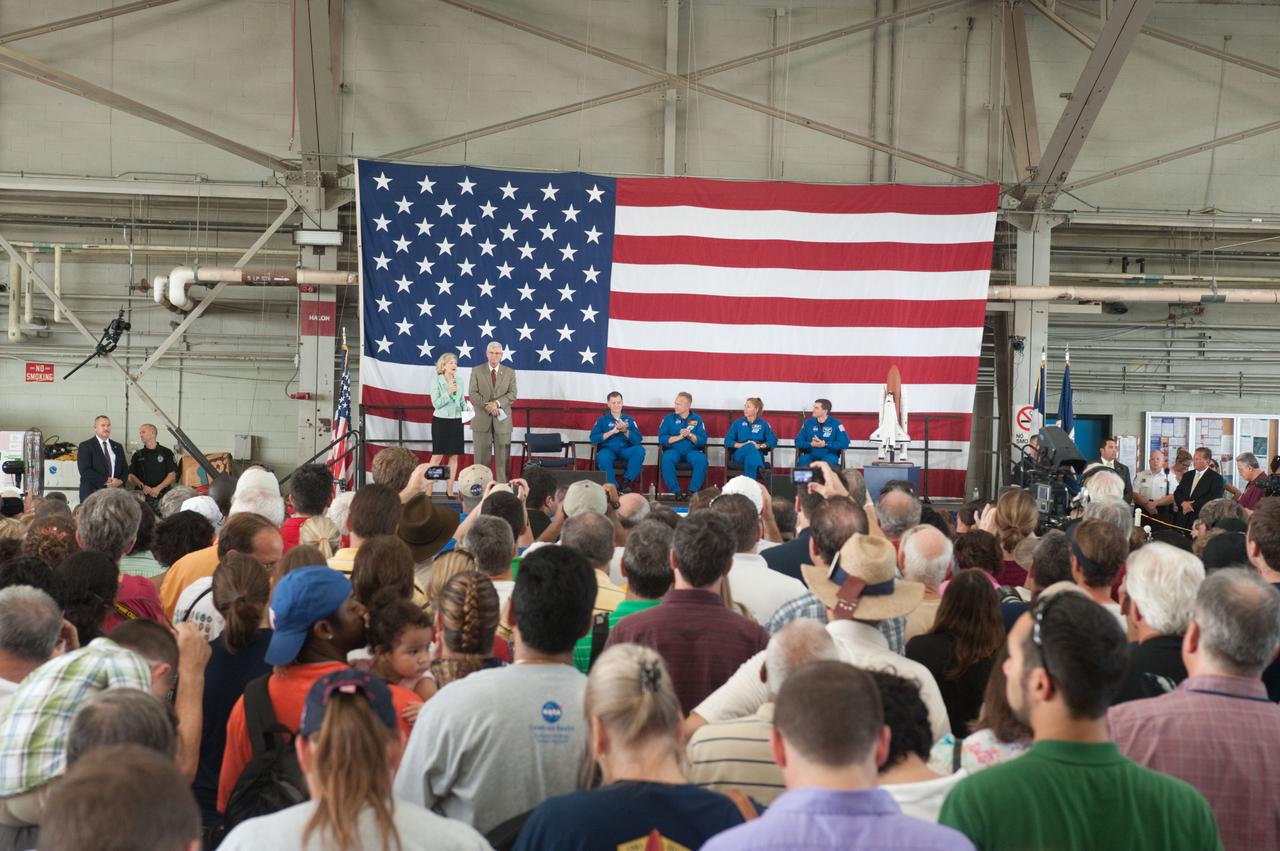 JSC2011-E-070374 (22 July 2011) --- U.S. Senator Kay Bailey Hutchison (R.-Texas), NASA's Johnson Space Center (JSC) director Michael L. Coats and STS-135 crew members are pictured in Ellington Field?s Hangar 990 near JSC during the STS-135 crew return ceremonies. Crew members (seated from the left) are NASA astronauts Chris Ferguson, commander; Doug Hurley, pilot; Sandy Magnus and Rex Walheim, both mission specialists. A large crowd of supporters is visible in the foreground. Photo credit: NASA