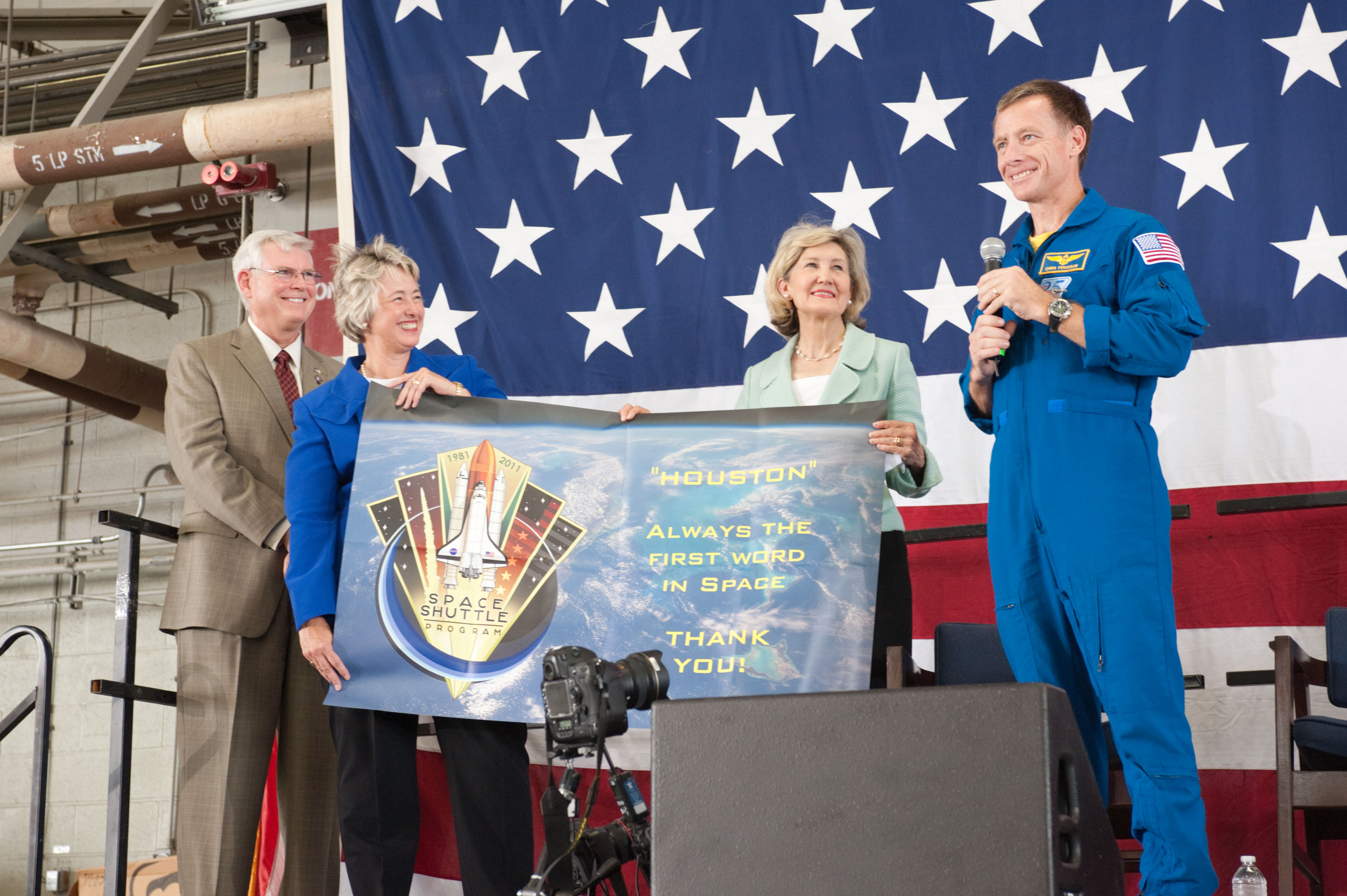 JSC2011-E-070471 (22 July 2011) --- NASA's Johnson Space Center (JSC) director Michael L. Coats (left), Houston Mayor Annise Parker, U.S. Senator Kay Bailey Hutchison (R.-Texas) and NASA astronaut Chris Ferguson, STS-135 commander, are pictured during the STS-135 crew return ceremony on July 22, 2011 at Ellington Field near JSC. Photo credit: NASA