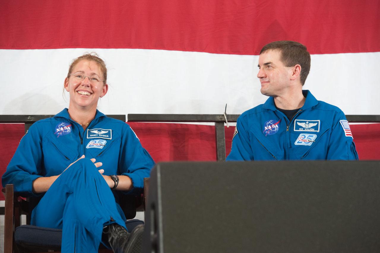 JSC2011-E-070500 (22 July 2011) --- NASA astronauts Sandy Magnus and Rex Walheim, both STS-135 mission specialists, are pictured during the STS-135 crew return ceremony on July 22, 2011 at Ellington Field near NASA?s Johnson Space Center. Photo credit: NASA
