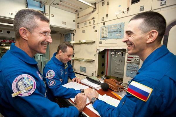 At the Gagarin Cosmonaut Training Center in Star City, Russia outside Moscow, Expedition 29 Flight Engineer Dan Burbank of NASA (left), Soyuz Commander Anton Shkaplerov (center) and Flight Engineer Anatoly Ivanishin take a break from their training August 25, 2011 as they prepare for their launch from the Baikonur Cosmodrome in Kazakhstan in their Soyuz TMA-22 spacecraft for a six-month stint on the International Space Station. Photo credit: Gagarin Cosmonaut Training Center