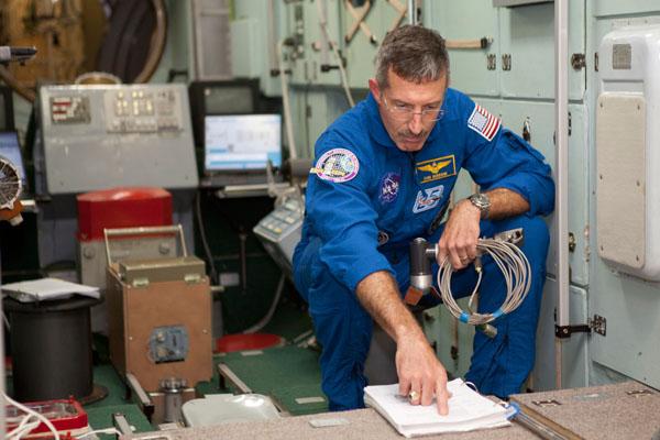 At the Gagarin Cosmonaut Training Center in Star City, Russia outside Moscow, Expedition 29 Flight Engineer Dan Burbank of NASA reviews Russian segment systems documents during a training session August 25, 2011 as he prepares for his launch from the Baikonur Cosmodrome in Kazakhstan in the Soyuz TMA-22 spacecraft with Soyuz Commander Anton Shkaplerov and Russian Flight Engineer Anatoly Ivanishin for a six-month stint on the International Space Station. Photo credit: Gagarin Cosmonaut Training Center