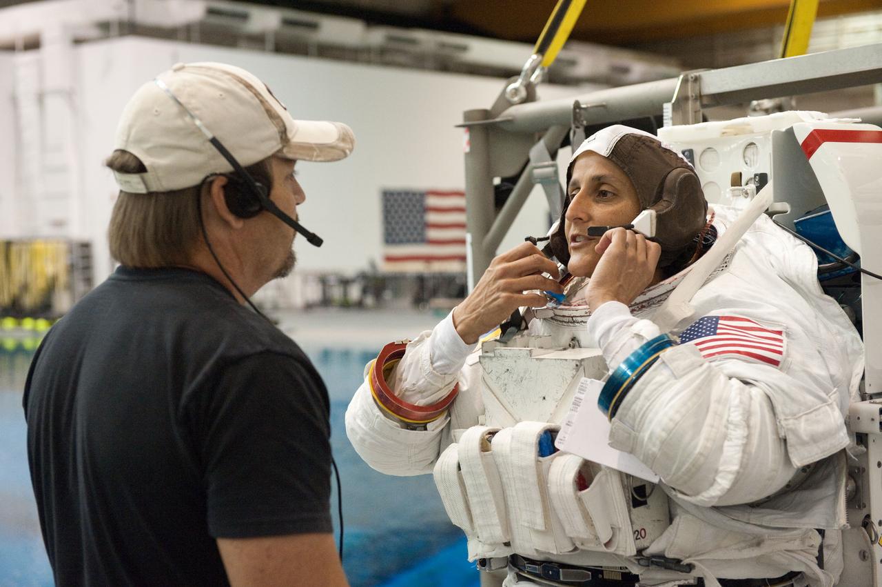 PHOTO DATE: 09-16-11  LOCATION: NBL - Pool Topside    SUBJECT: Expedition 31 crew members Suni Williams and Aki Hoshide conduct pre-test briefings, preparations and then suit up for EVA training before entering the pool at the Sonny Carter Training Facility. PHOTOGRAPHER: Devin Boldt 