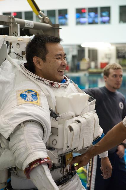 NASA image: Expedition 32 crew members Suni Williams and Aki Hoshide conduct pre-test briefings