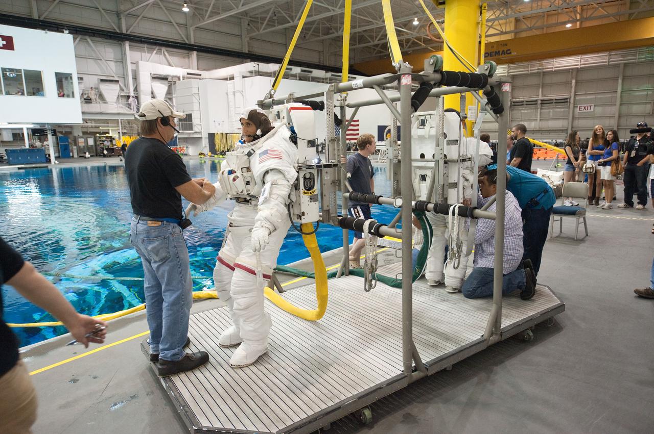 PHOTO DATE: 09-16-11  LOCATION: NBL - Pool Topside    SUBJECT: Expedition 31 crew members Suni Williams and Aki Hoshide conduct pre-test briefings, preparations and then suit up for EVA training before entering the pool at the Sonny Carter Training Facility. PHOTOGRAPHER: Devin Boldt 