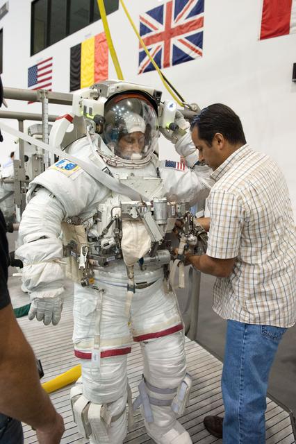 NASA image: Expedition 32 crew members Suni Williams and Aki Hoshide conduct pre-test briefings