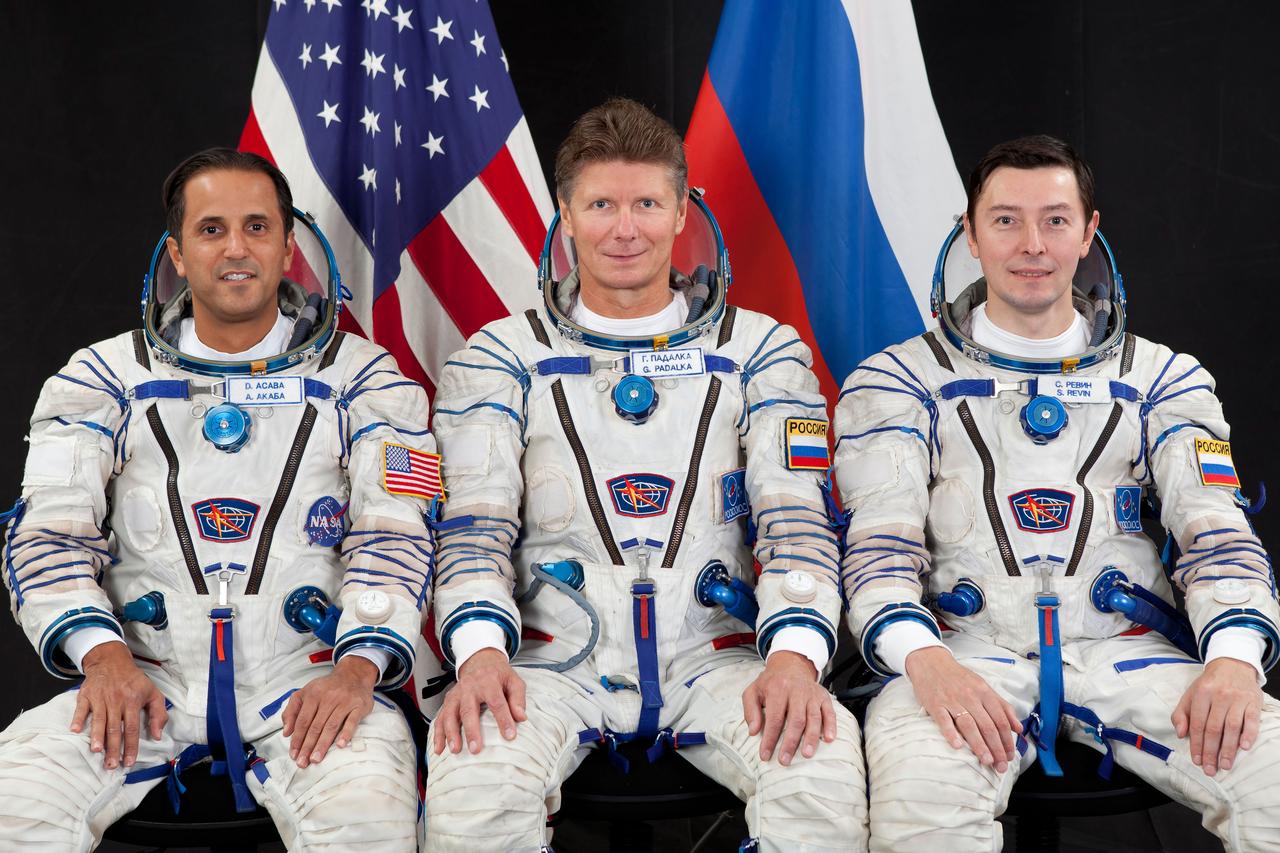 JSC2011-E-196329 (23 Aug. 2011) --- Attired in Russian Sokol launch and entry suits, NASA astronaut Joe Acaba (left), along with Russian cosmonauts Gennady Padalka (center) and Sergei Revin, all Expedition 29 backup crew members, take a break from training in Star City, Russia to pose for a portrait. Photo credit: Gagarin Cosmonaut Training Center