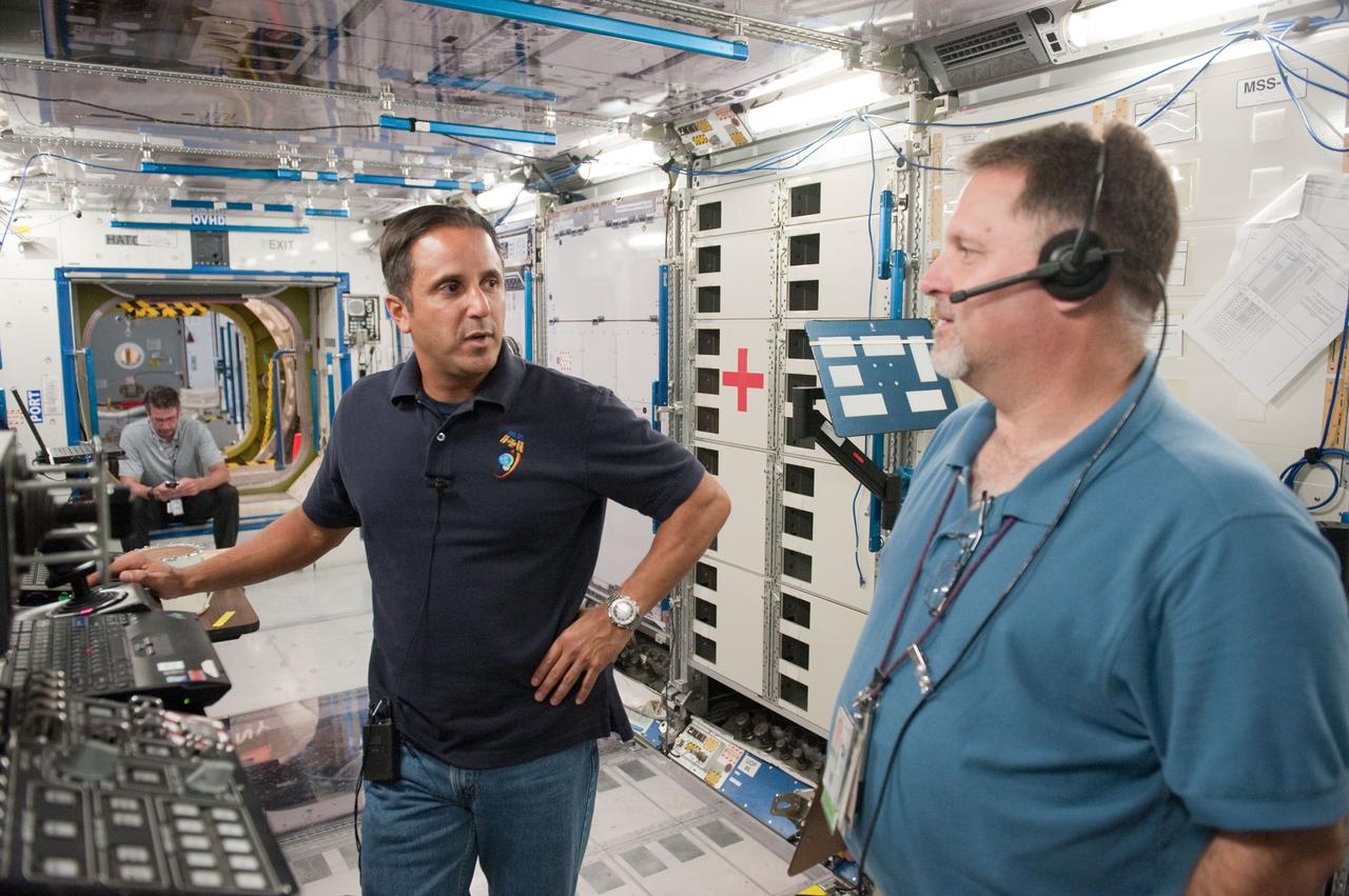 DATE: 10-17-11 LOCATION: Building 9 - ISS Trainers SUBJECT: Expedition 31/32 crew—Padalka, Revin and Acaba—during some of their Emergency Scenarios training. PHOTOGRAPHER: Lauren Harnett