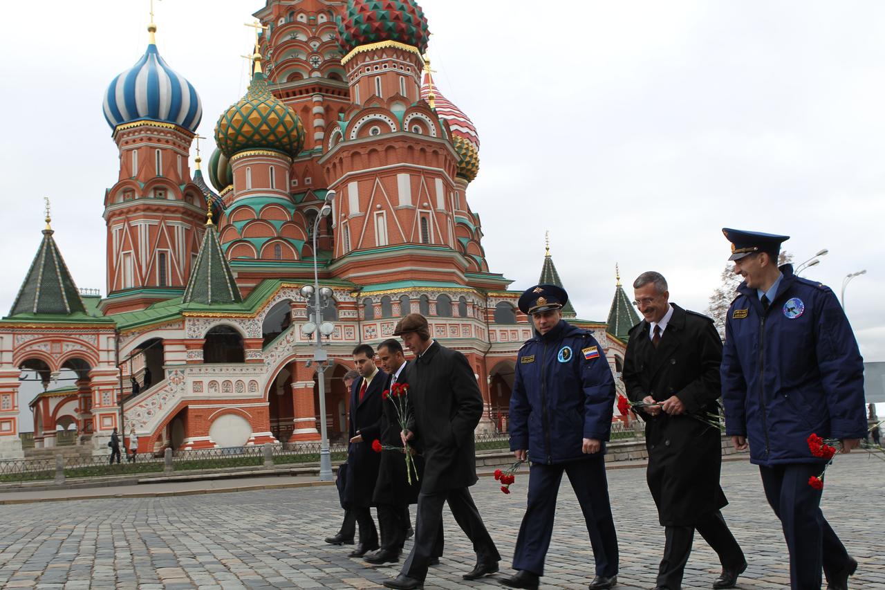 With famed St. Basil’s Cathedral in the background, the prime and backup crews for the upcoming Expedition 30 launch to the International Space Station toured Red Square in Moscow October 24, 2011 as part of their ceremonial pre-launch activities. From right to left are prime crewmembers Anatoly Ivanishin, NASA’s Dan Burbank and Soyuz Commander Anton Shkaplerov. Along with backup crewmembers Sergei Revin and NASA’s Joe Acaba. Backup crewmember Gennady Padalka is not seen. At the far left with the crewmembers is NASA’s Joel Montalbano, the Director of Human Spaceflight Programs in Russia. Burbank, Shkaplerov and Ivanishin will launch on November 14 in the Soyuz TMA-22 spacecraft from the Baikonur Cosmodrome in Kazakhstan.  Credit: NASA 