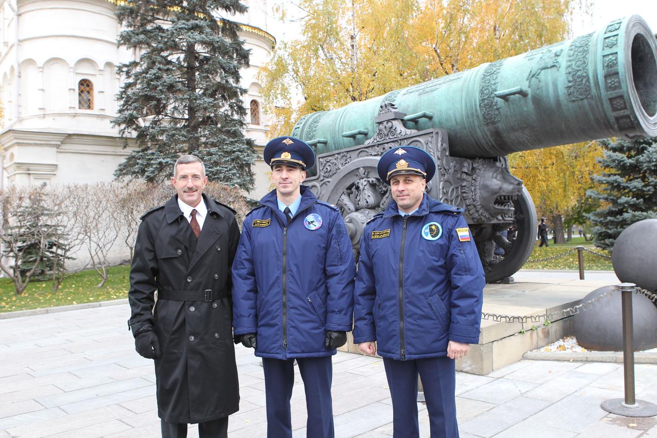 The next residents of the International Space Station pose for pictures in front of the Tsar Cannon at the Kremlin in Moscow October 24, 2011 after completing the traditional laying of flowers at the Kremlin Wall off of Red Square as part of their pre-launch activities. Expedition 30 Commander Dan Burbank (left), Flight Engineer Anatoly Ivanishin (center) and Soyuz Commander Anton Shkaplerov (right) will launch on November 14 in their Soyuz TMA-22 spacecraft from the Baikonur Cosmodrome in Kazakhstan.  Credit: NASA 