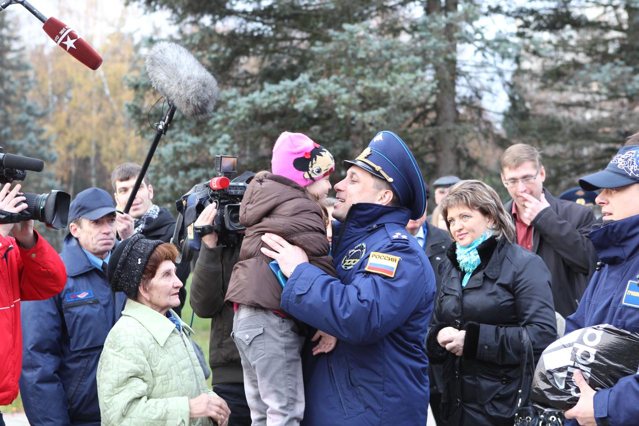 At the Gagarin Cosmonaut Training Center in Star City, Russia, Expedition 29/30 Soyuz Commander Anton Shkaplerov says goodbye to his daughter October 31, 2011, as he departed for his launch site in Baikonur, Kazakhstan. Shkaplerov, Expedition 30 Commander Dan Burbank of NASA and Flight Engineer Anatoly Ivanishin will launch November 14 from Baikonur on their Soyuz TMA-22 spacecraft for the International Space Station.  Credit: NASA 