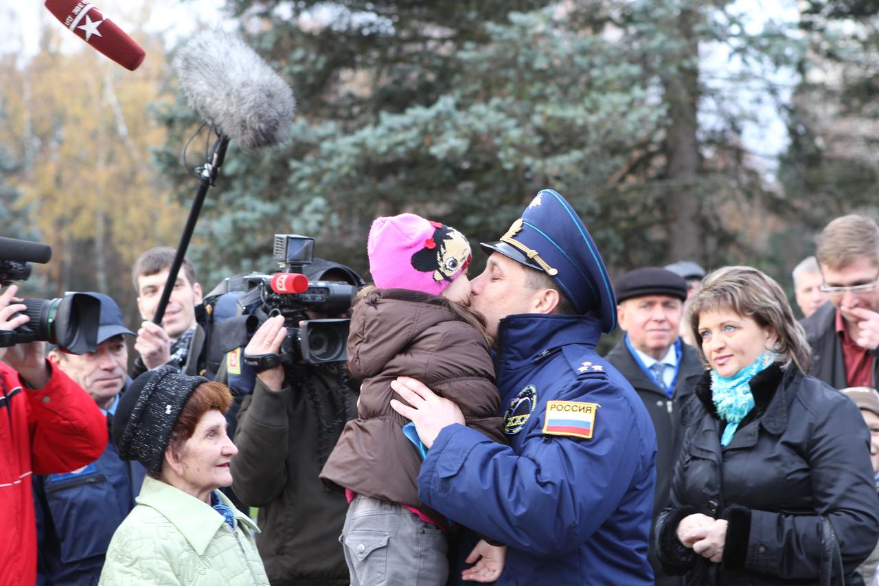 At the Gagarin Cosmonaut Training Center in Star City, Russia, Expedition 29/30 Soyuz Commander Anton Shkaplerov says goodbye to his daughter October 31, 2011, as he departed for his launch site in Baikonur, Kazakhstan. Shkaplerov, Expedition 30 Commander Dan Burbank of NASA and Flight Engineer Anatoly Ivanishin will launch November 14 from Baikonur on their Soyuz TMA-22 spacecraft for the International Space Station.  Credit: NASA 