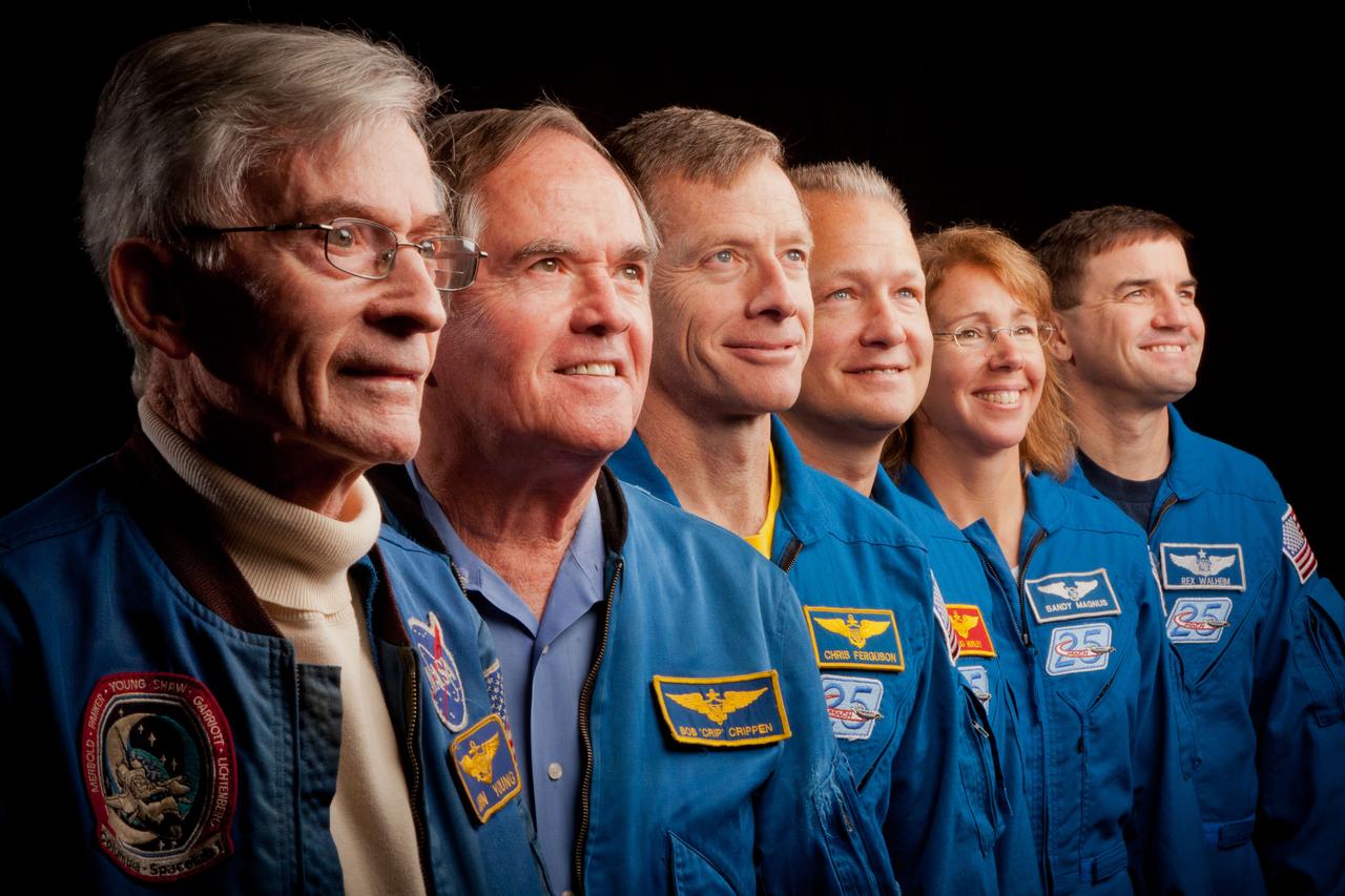 JSC2011-E-205596 (2 Nov. 2011) --- The current and former astronauts who formed the crews of STS-1, the first space shuttle mission, and STS-135, the final shuttle mission, pose for a group photo at the Johnson Space Center in Houston on Nov. 2, 2011. They are, from left, John Young, STS-1 commander, Robert Crippen, STS-1 pilot, with the STS-135 crew of commander Chris Ferguson, pilot Doug Hurley and mission specialists Sandy Magnus and Rex Walheim. Photo credit: NASA Photo/Houston Chronicle, Smiley N. Pool