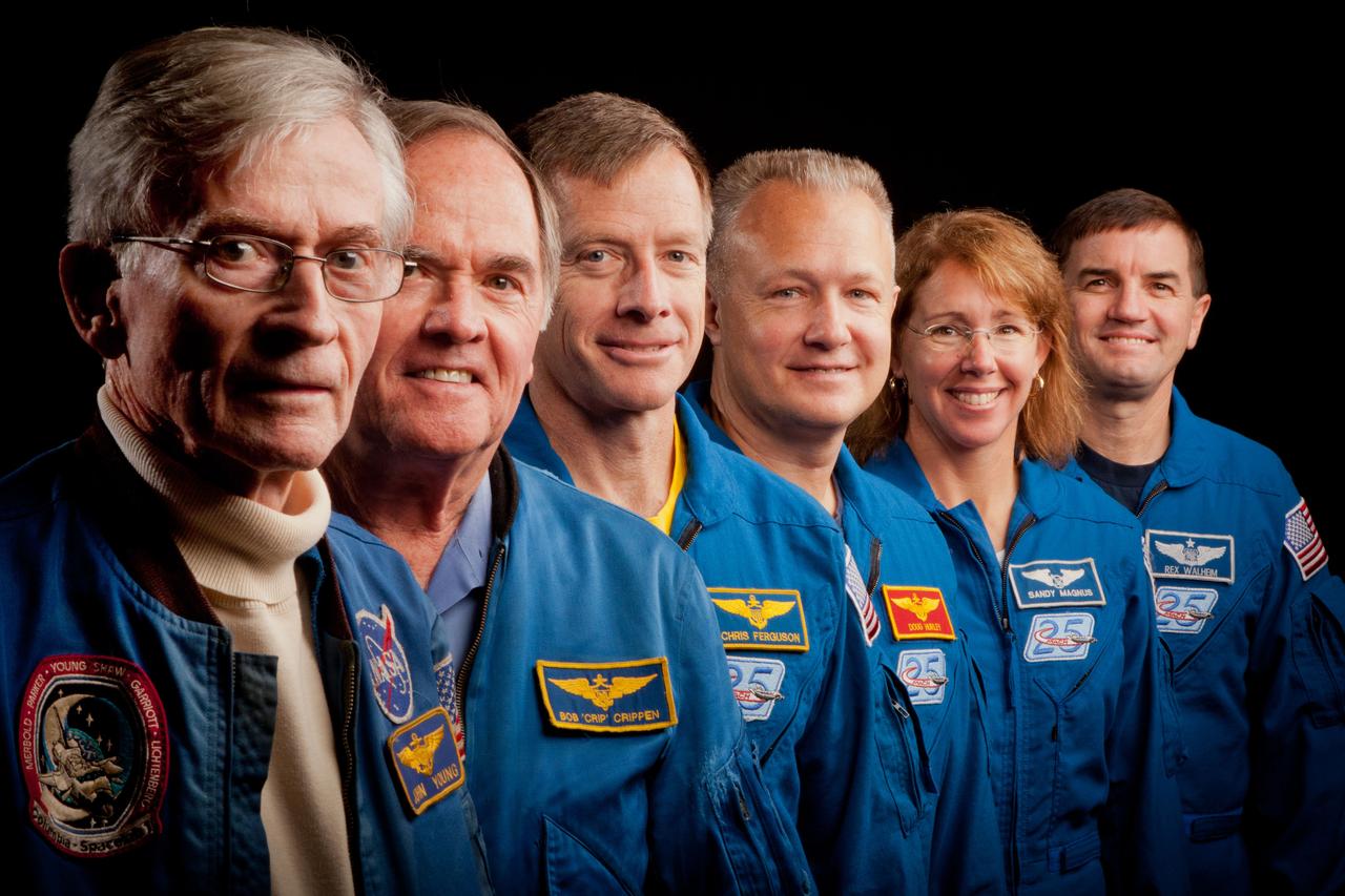 JSC2011-E-205603 (2 Nov. 2011) --- The current and former astronauts who formed the crews of STS-1, the first space shuttle mission, and STS-135, the final shuttle mission, pose for a group photo at the Johnson Space Center in Houston on Nov. 2, 2011. They are, from left, John Young, STS-1 commander, Robert Crippen, STS-1 pilot, with the STS-135 crew of commander Chris Ferguson, pilot Doug Hurley and mission specialists Sandy Magnus and Rex Walheim. Photo credit: NASA Photo/Houston Chronicle, Smiley N. Pool