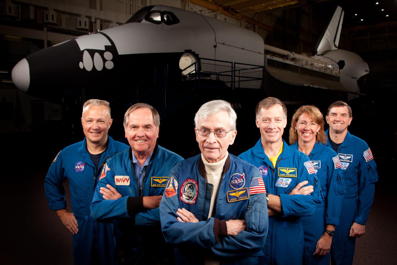 JSC2011-E-205608 (2 Nov. 2011) --- The current and former astronauts who formed the crews of STS-1, the first space shuttle mission, and STS-135, the final shuttle mission, pose for a group photo in a training facility at the Johnson Space Center in Houston on Nov. 2, 2011. They are, from left, Doug Hurley, STS-135 pilot, Robert Crippen, STS-1 pilot, John Young, STS-1 commander, with STS-135 commander Chris Ferguson, and mission specialists Sandy Magnus and Rex Walheim. Photo credit: NASA Photo/Houston Chronicle, Smiley N. Pool