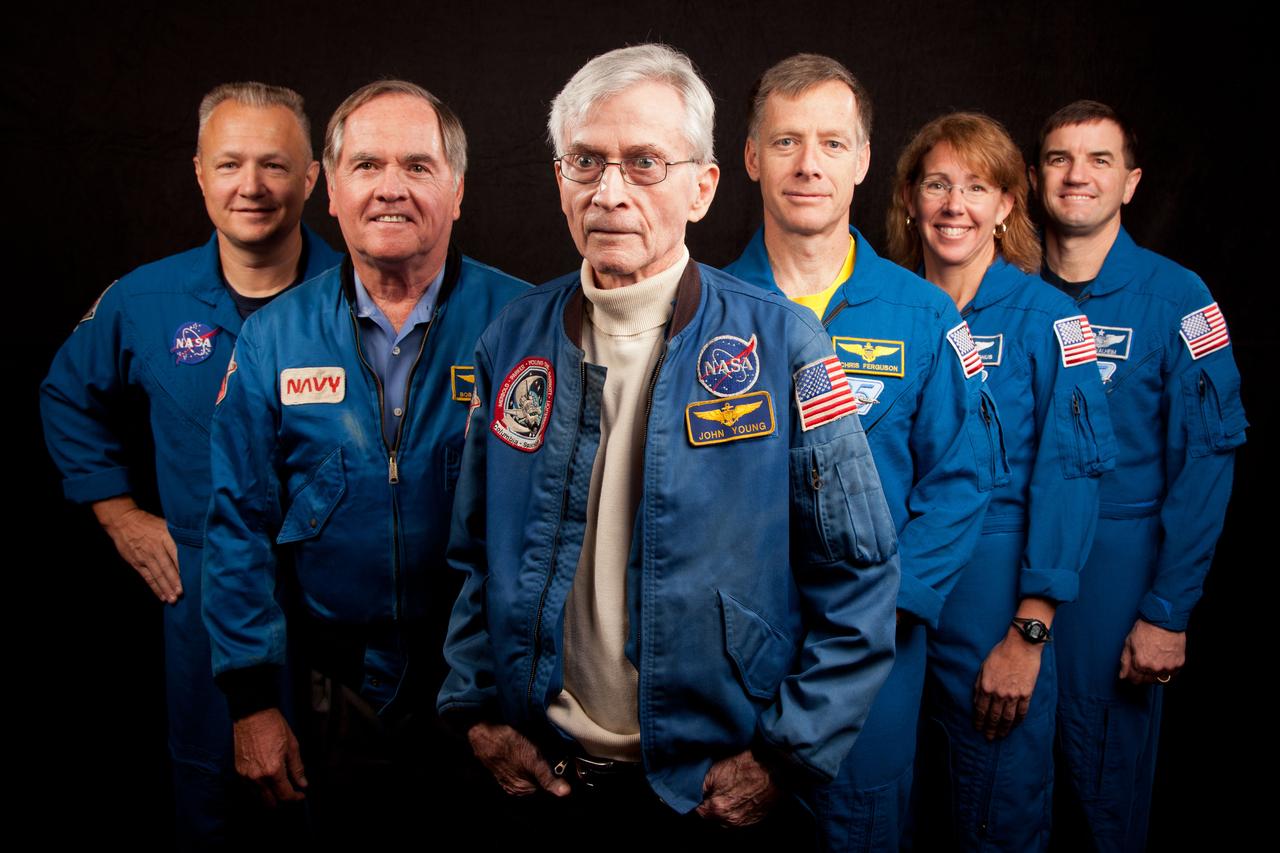 JSC2011-E-205613 (2 Nov. 2011) --- The current and former astronauts who formed the crews of STS-1, the first space shuttle mission, and STS-135, the final shuttle mission, pose for a group photo at the Johnson Space Center in Houston on Nov. 2, 2011. They are, from left, Doug Hurley, STS-135 pilot, Robert Crippen, STS-1 pilot, John Young, STS-1 commander, with STS-135 commander Chris Ferguson, and mission specialists Sandy Magnus and Rex Walheim. Photo credit: NASA Photo/Houston Chronicle, Smiley N. Pool