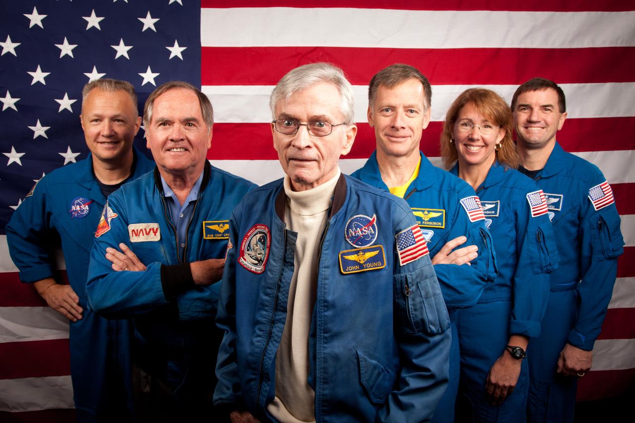 JSC2011-E-205619 (2 Nov. 2011) --- The current and former astronauts who formed the crews of STS-1, the first space shuttle mission, and STS-135, the final shuttle mission, pose for a group photo at the Johnson Space Center in Houston on Nov. 2, 2011. They are, from left, Doug Hurley, STS-135 pilot, Robert Crippen, STS-1 pilot, John Young, STS-1 commander, with STS-135 commander Chris Ferguson, and mission specialists Sandy Magnus and Rex Walheim. Photo credit: NASA Photo/Houston Chronicle, Smiley N. Pool