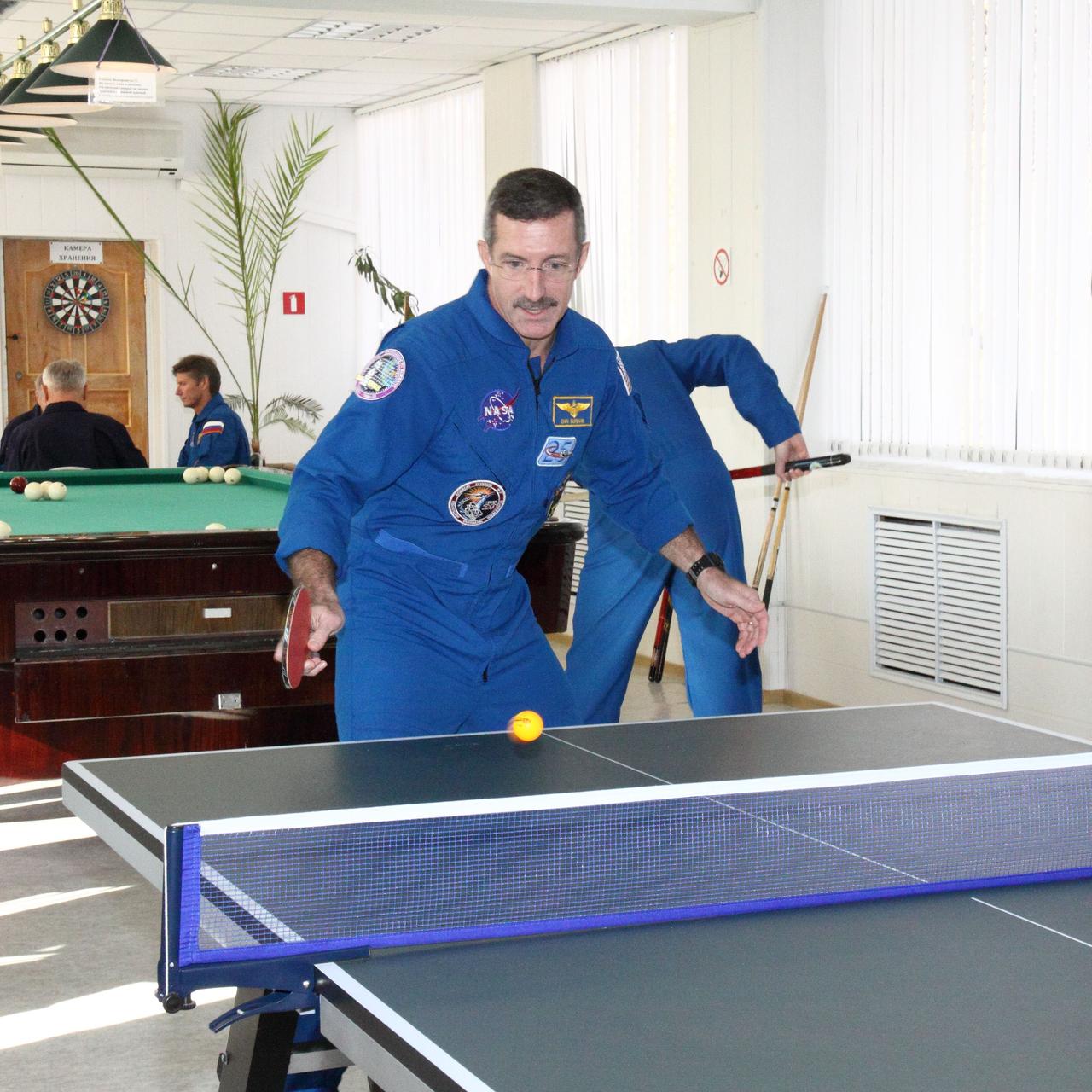 In Baikonur, Kazakhstan, Expedition 30 Commander Dan Burbank of NASA enjoys a game of ping-pong at his Cosmonaut Hotel crew quarters November 8, 2011. Burbank, Soyuz Commander Anton Shkaplerov and Flight Engineer Anatoly Ivanishin will launch in the Soyuz TMA-22 spacecraft on November 14 from Baikonur bound for the International Space Station.  Credit: NASA/Victor Zelentsov 