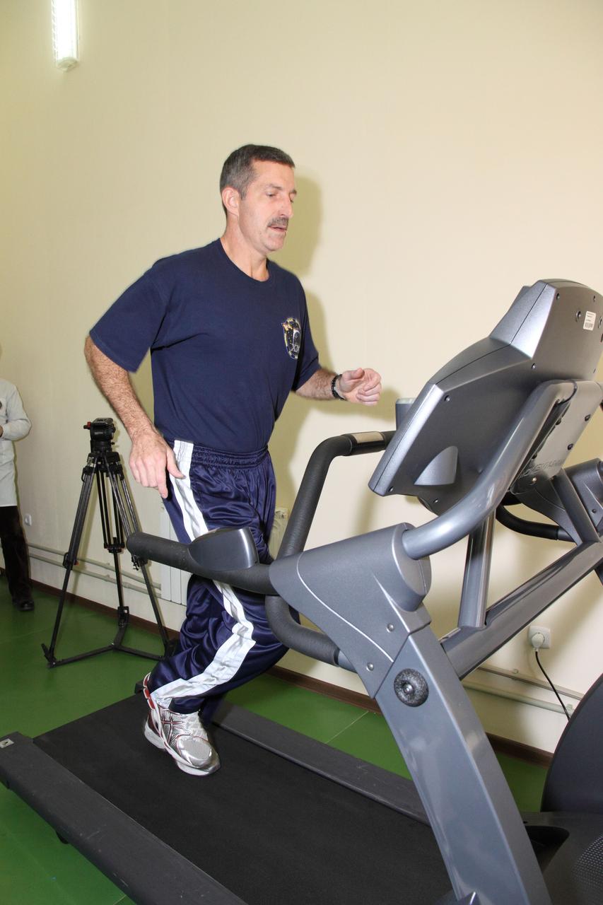 In Baikonur, Kazakhstan, Expedition 30 Commander Dan Burbank of NASA gets in some exercise on a treadmill at his Cosmonaut Hotel crew quarters November 8, 2011. Burbank, Soyuz Commander Anton Shkaplerov and Flight Engineer Anatoly Ivanishin will launch in the Soyuz TMA-22 spacecraft on November 14 from Baikonur bound for the International Space Station. Credit: NASA/Victor Zelentsov
