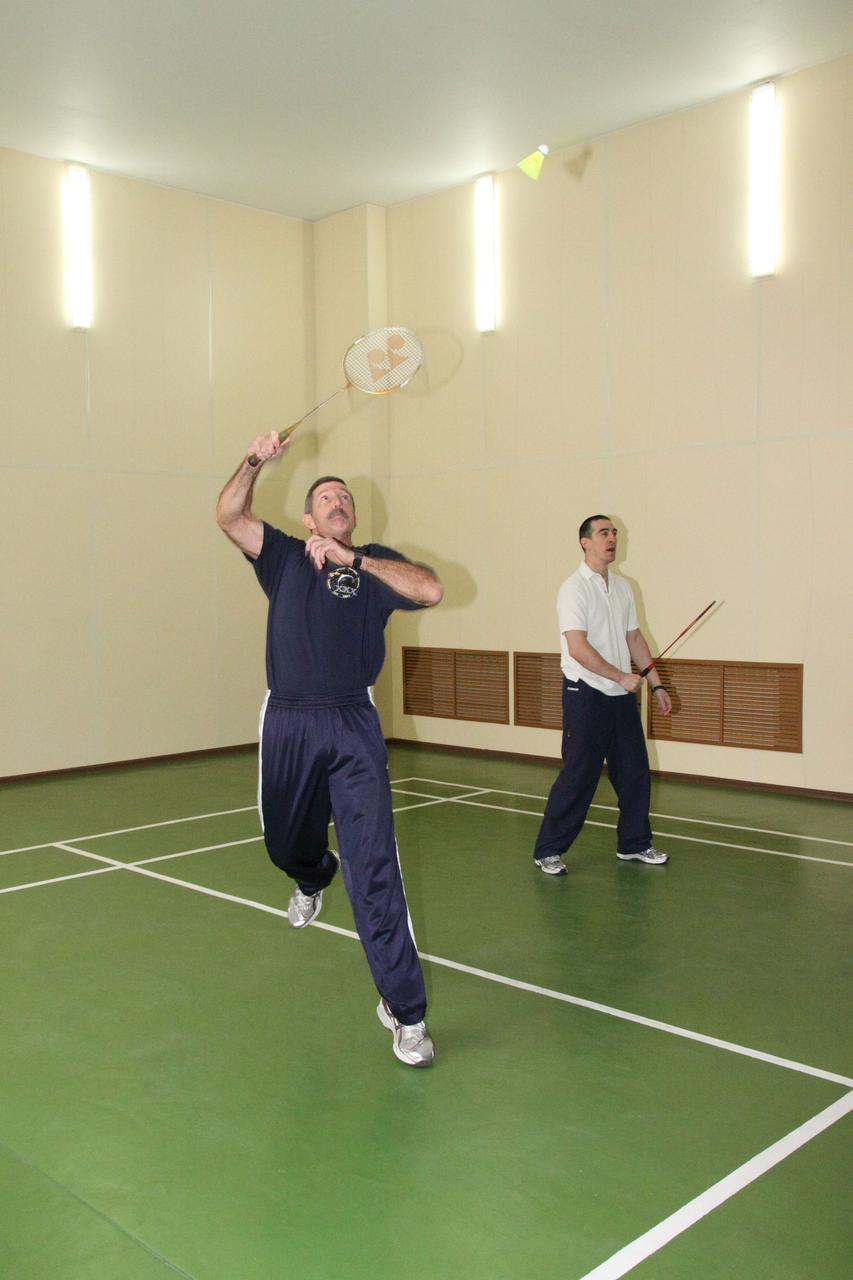 In Baikonur, Kazakhstan, Expedition 30 Commander Dan Burbank of NASA (left) and Flight Engineer Anatoly Ivanishin play a game of badminton at their crew quarters at the Cosmonaut Hotel on November 8, 2011. Burbank, Ivanishin and Soyuz Commander Anton Shkaplerov will launch from Baikonur on November 14 in their Soyuz TMA-22 spacecraft to the International Space Station.  Credit:  NASA/Victor Zelentsov 