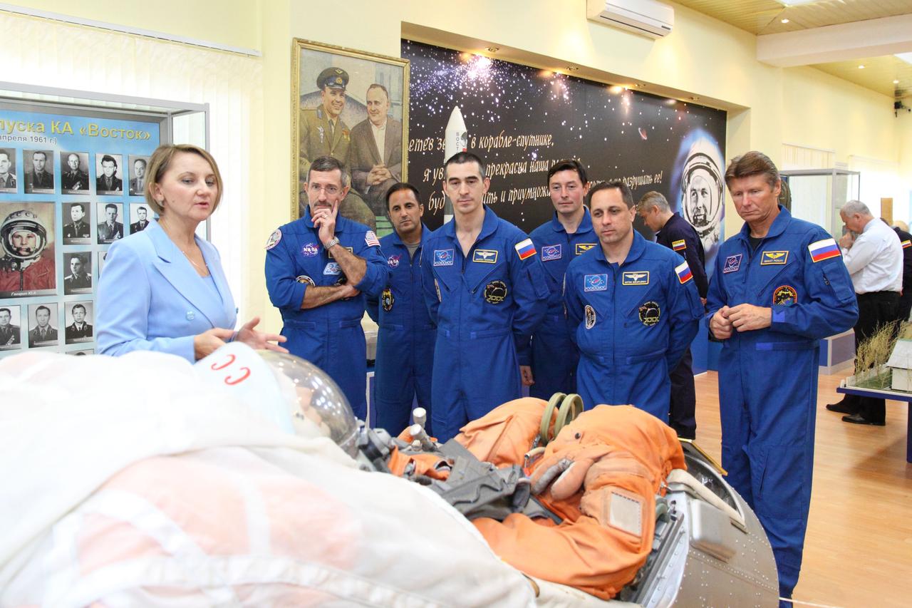 At the Baikonur Cosmodrome in Kazakhstan, the Expedition 30 prime and backup crews toured the Korolev Museum November 9, 2011 as they prepared for launch November 14 on the Soyuz TMA-22 spacecraft from Baikonur to the International Space Station. As a tour guide provided historical information on a Soyuz mockup, listening from left to right are Expedition 30 Commander and prime crewmember Dan Burbank of NASA, backup Flight Engineer Joe Acaba of NASA, prime Flight Engineer Anatoly Ivanishin, backup crewmember Sergei Revin, prime Soyuz Commander Anton Shkaplerov and backup crewmember Gennady Padalka.  Credit: NASA/Victor Zelentsov 