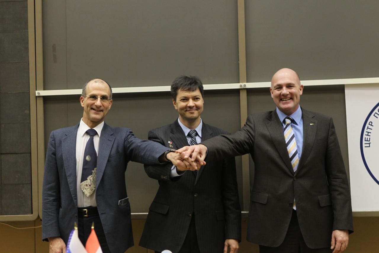 At the Gagarin Cosmonaut Training Center in Star City, Russia, the next trio to launch to the International Space Station pose for pictures during their traditional crew news conference Dec. 1, 2011. From left to right are Expedition 30 NASA Flight Engineer Don Pettit, Flight Engineer Andre Kuipers of the European Space Agency and Soyuz Commander Oleg Kononenko. The crewmembers will launch from the Baikonur Cosmodrome in Kazakhstan on Dec. 21 on their Soyuz TMA-03M spacecraft.  Credit: NASA 