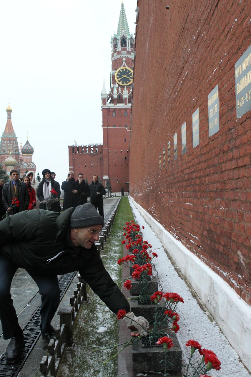 At the Kremlin Wall in Moscow, Expedition 30 NASA Flight Engineer Don Pettit lays flowers at the site where Russian space heroes are interred during a traditional ceremony Dec. 1, 2011. Pettit, Soyuz Commander Oleg Kononenko and Flight Engineer Andre Kuipers of the European Space Agency will launch on Dec. 21 from the Baikonur Cosmodrome in Kazakhstan on their Soyuz TMA-03M spacecraft to the International Space Station.  Credit: NASA 