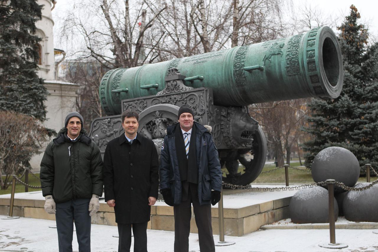 At the Kremlin in Moscow, the prime crew for the next launch of Expedition 30 crewmembers to the International Space Station pose for pictures Dec. 1, 2011 in front of the Tsar Cannon following traditional ceremonial activities at Red Square. From left to right are NASA Flight Engineer Don Pettit, Soyuz Commander Oleg Kononenko and Flight Engineer Andre Kuipers of the European Space Agency. The trio will launch Dec. 21 from the Baikonur Cosmodrome in Kazakhstan on their Soyuz TMA-03M spacecraft.  Credit: NASA  