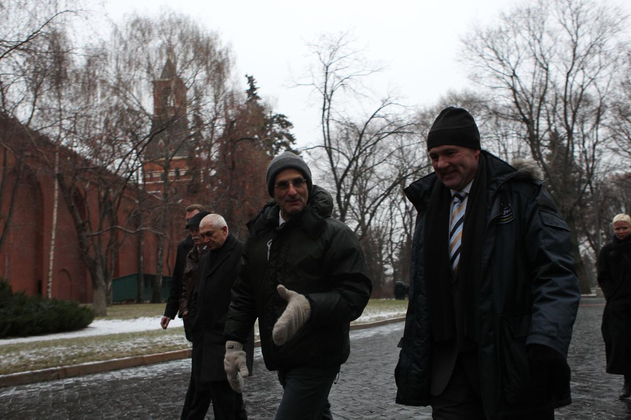 At the Kremlin in Moscow, Expedition 30 NASA Flight Engineer Don Pettit (left, foreground) and Flight Engineer Andre Kuipers of the European Space Agency stroll to their next destination following ceremonial activities in Red Square Dec. 1, 2011. Pettit, Kuipers and Soyuz Commander Oleg Kononenko will launch Dec. 21 from the Baikonur Cosmodrome in Kazakhstan in their Soyuz TMA-03M spacecraft.  Credit: NASA 