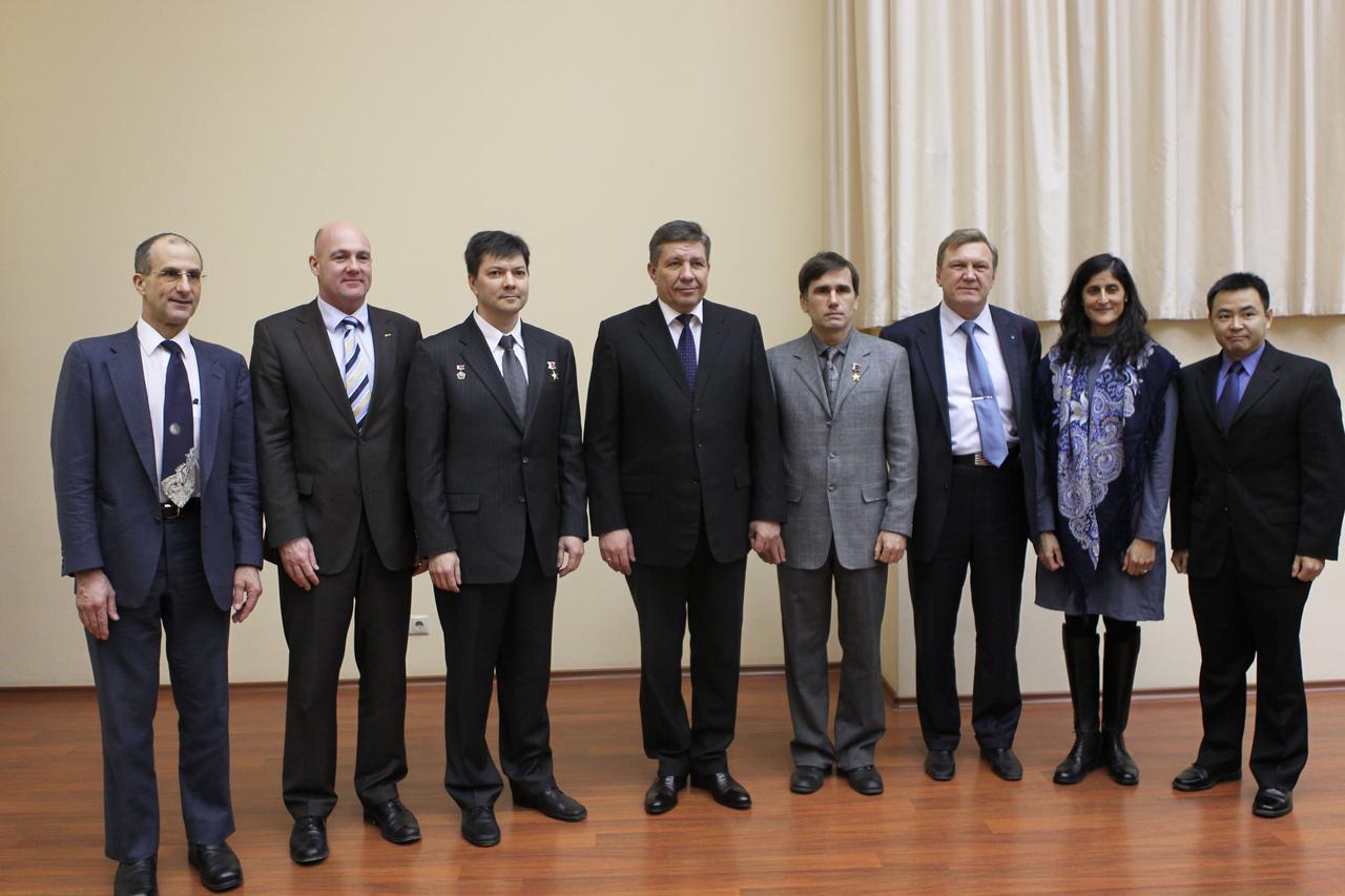 At the headquarters of the Russian Federal Space Agency, the head of Roscosmos, Vladimir Popovkin (fourth from the left) and Alexei Krasnov (third from the right) pose for pictures with the Expedition 30/31 prime and backup crewmembers Dec. 6, 2011 prior to their departure Dec. 8 for their launch site in Baikonur, Kazakhstan. From left to right are prime crewmembers NASA Flight Engineer Don Pettit, Flight Engineer Andre Kuipers of the European Space Agency and Soyuz Commander Oleg Kononenko, Popovkin, backup Soyuz Commander Yuri Malenchenko, Krasnov, backup NASA Flight Engineer Suni Williams and backup Flight Engineer Aki Hoshide of the Japan Aerospace Exploration Agency. Pettit, Kuipers and Kononenko will launch to the International Space Station Dec. 21 in their Soyuz TMA-03M spacecraft.  Credit: NASA 
