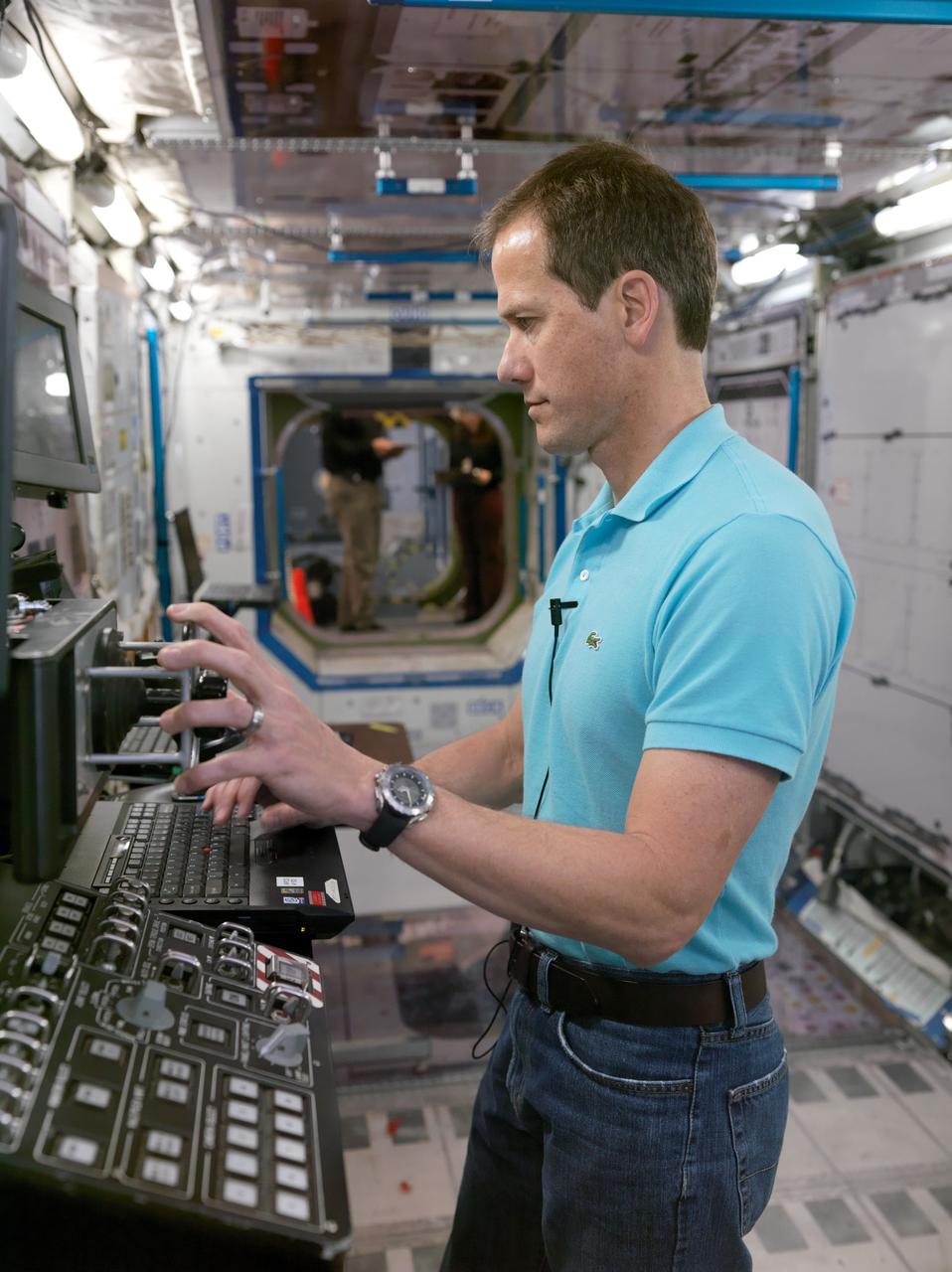 JSC2011-E-215222 (5 Dec. 2011) --- NASA astronaut Tom Marshburn, Expedition 34/35 flight engineer, participates in an emergency scenario training session in an International Space Station mock-up/trainer in the Space Vehicle Mock-up Facility at NASA's Johnson Space Center. Photo credit: NASA