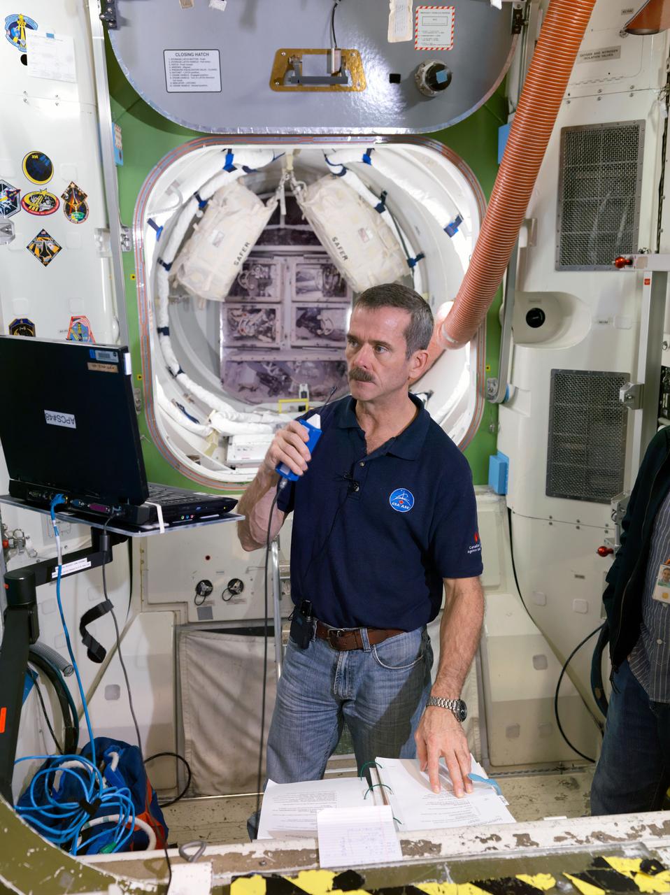 JSC2011-E-215227 (5 Dec. 2011) --- Canadian Space Agency astronaut Chris Hadfield, Expedition 34 flight engineer and Expedition 35 commander, participates in an emergency scenario training session in an International Space Station mock-up/trainer in the Space Vehicle Mock-up Facility at NASA's Johnson Space Center. Photo credit: NASA