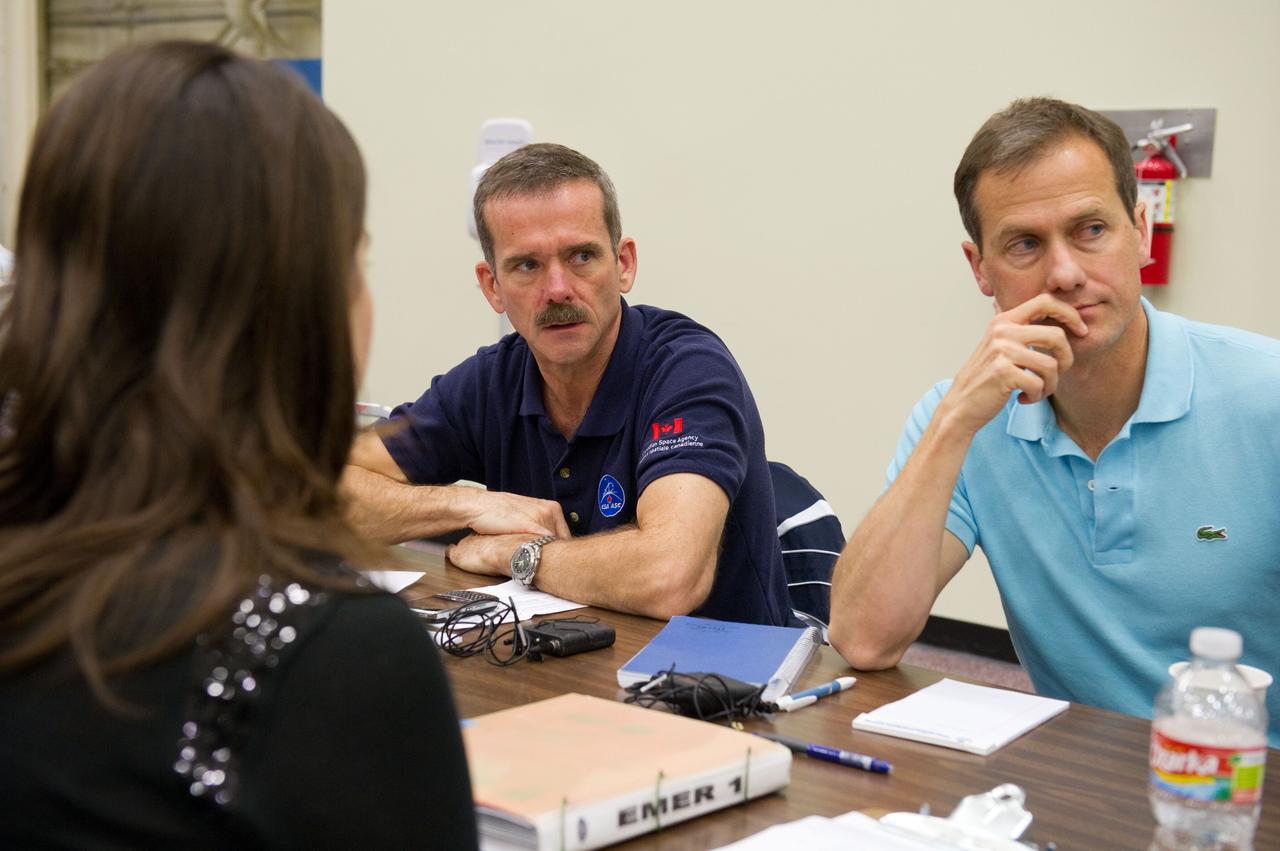 Date: 12-05-11 Location: Bldg 9NW, ISS Mockup Subject:  Expedition 33 Soyuz crew Tom Marshburn and Chris Hadfield during their Emergency Scene training Photographer: James Blair