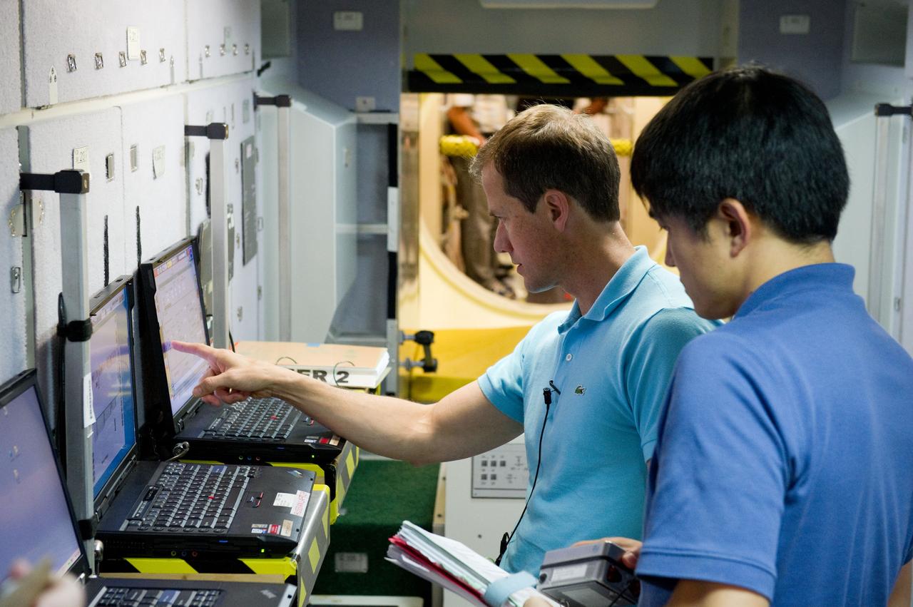 Date: 12-05-11 Location: Bldg 9NW, ISS Mockup Subject:  Expedition 33 Soyuz crew Tom Marshburn and Chris Hadfield during their Emergency Scene training Photographer: James Blair