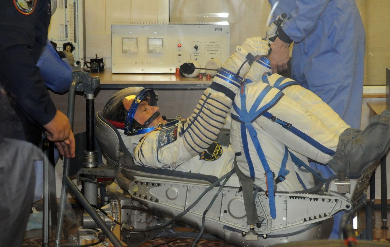 At the Baikonur Cosmodrome in Kazakhstan, Expedition 30 Flight Engineer Andre Kuipers of the European Space Agency undergoes a leak check of his Russian Sokol launch and entry suit Dec. 9, 2011 as he prepare for launch Dec. 21 on the Soyuz TMA-03M spacecraft to the International Space Station with crewmates Soyuz Commander Oleg Kononenko and Flight Engineer Don Pettit of NASA.  Credit: NASA 