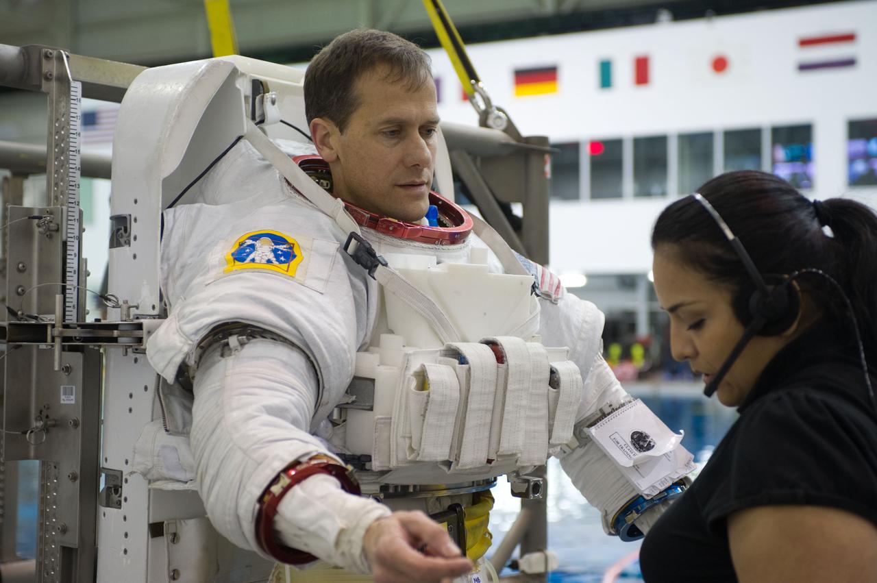Expedition 34 astronaut crew members Chris Hadfield and Tom Marshburn during INC-34/CB ISS EVA 2 91027.  Photo Date: December 7, 2011.  Location: NBL - Pool Topside.  Photographer: Robert Markowitz