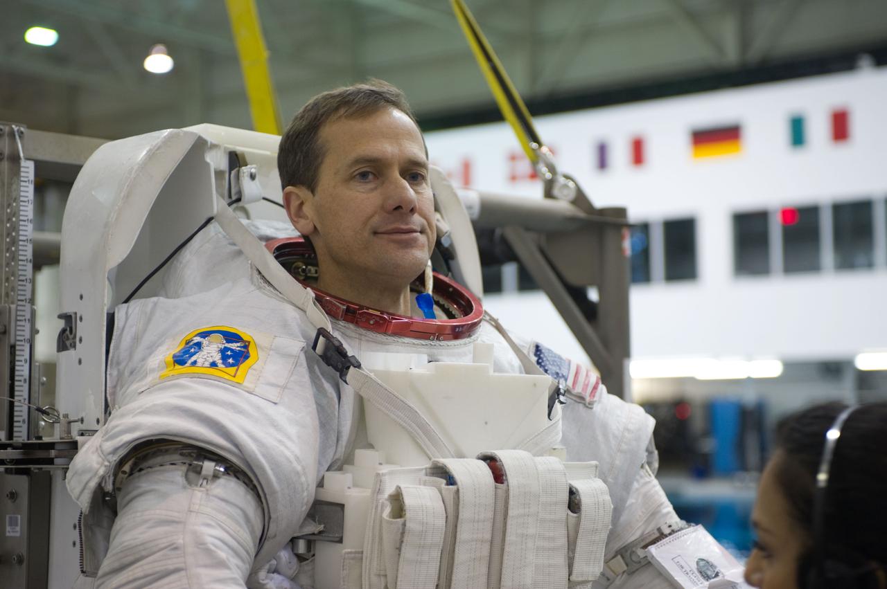 Expedition 34 astronaut crew members Chris Hadfield and Tom Marshburn during INC-34/CB ISS EVA 2 91027. Photo Date: December 7, 2011. Location: NBL - Pool Topside. Photographer: Robert Markowitz