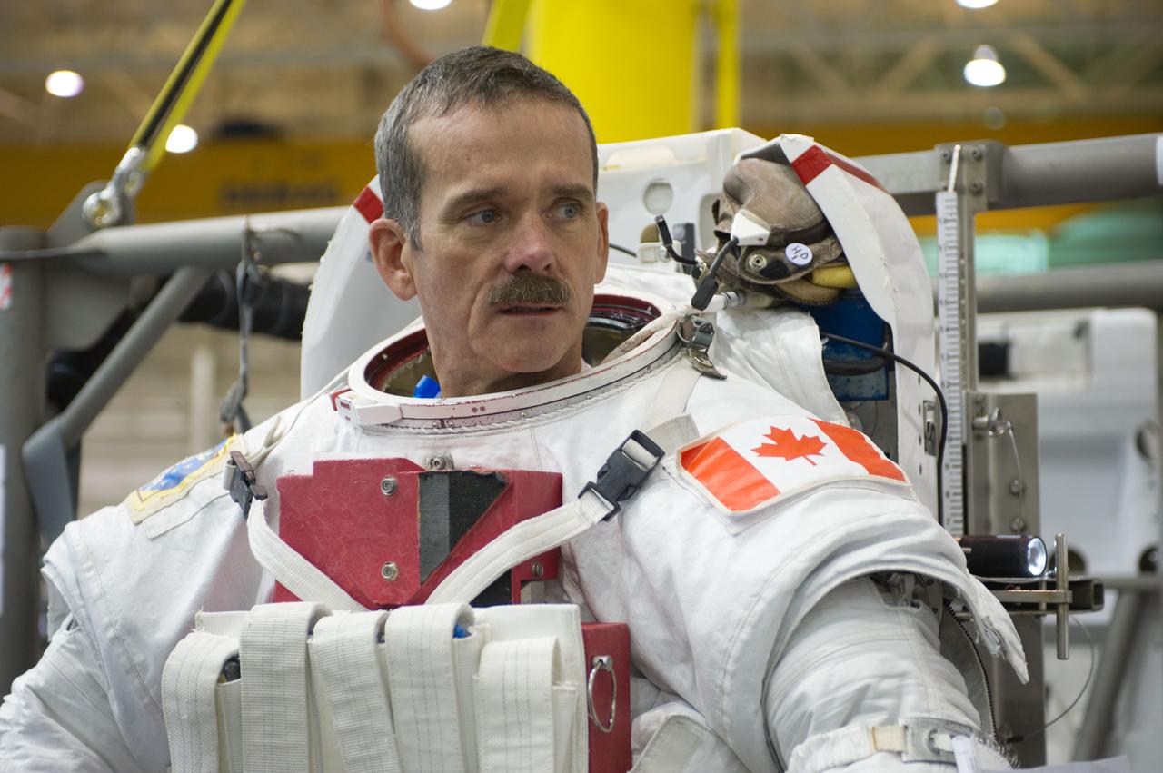 Expedition 34 astronaut crew members Chris Hadfield and Tom Marshburn during INC-34/CB ISS EVA 2 91027. Photo Date: December 7, 2011. Location: NBL - Pool Topside. Photographer: Robert Markowitz