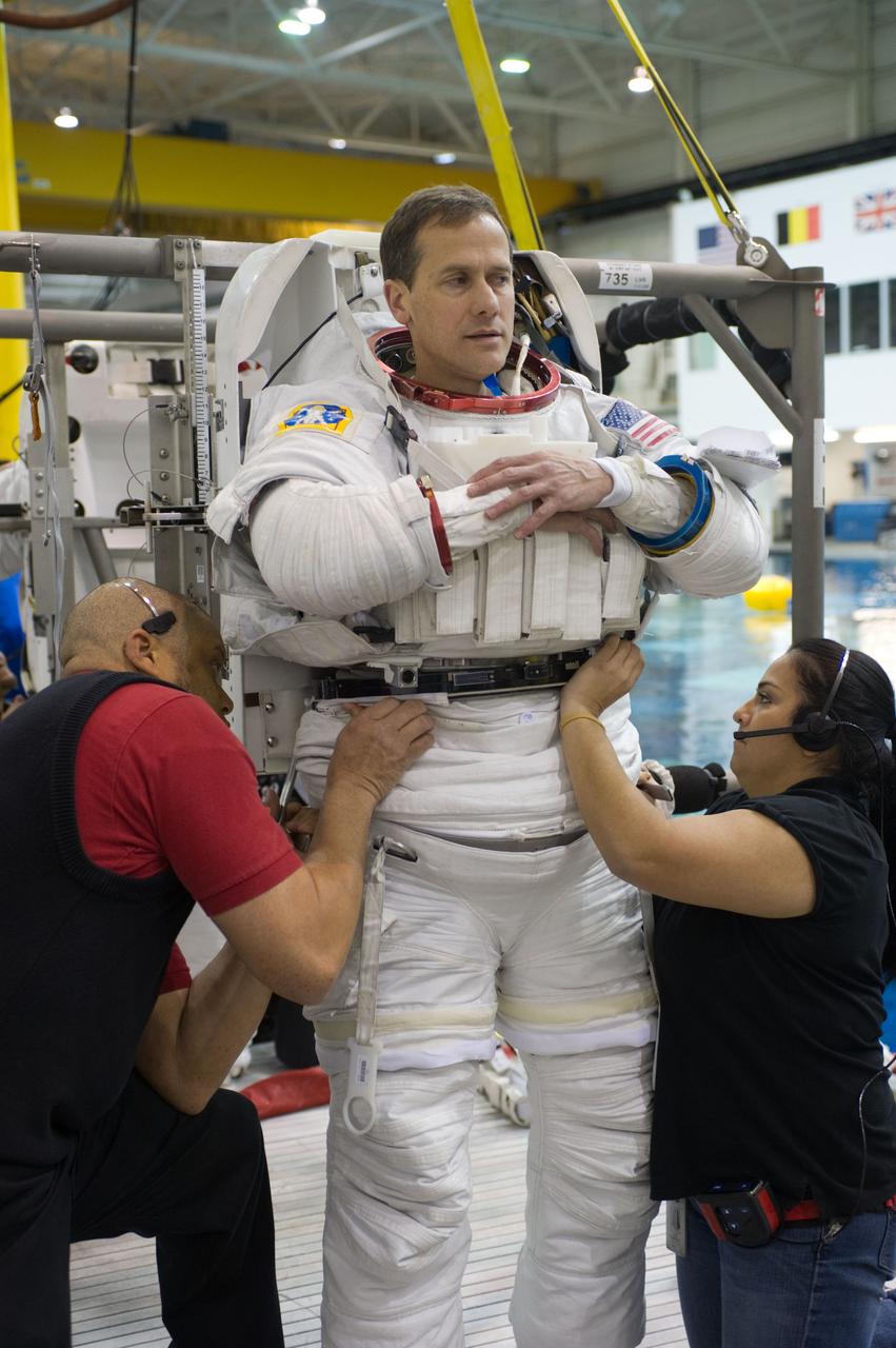 Expedition 34 astronaut crew members Chris Hadfield and Tom Marshburn during INC-34/CB ISS EVA 2 91027. Photo Date: December 7, 2011. Location: NBL - Pool Topside. Photographer: Robert Markowitz