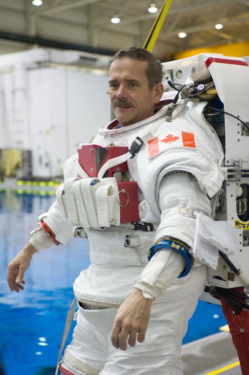 Expedition 34 astronaut crew members Chris Hadfield and Tom Marshburn during INC-34/CB ISS EVA 2 91027. Photo Date: December 7, 2011. Location: NBL - Pool Topside. Photographer: Robert Markowitz