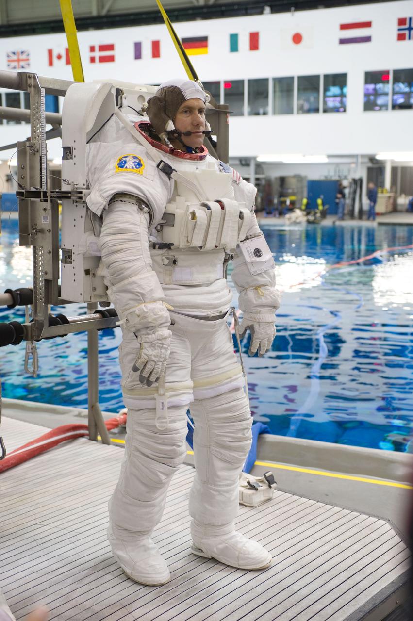 Expedition 34 astronaut crew members Chris Hadfield and Tom Marshburn during INC-34/CB ISS EVA 2 91027. Photo Date: December 7, 2011. Location: NBL - Pool Topside. Photographer: Robert Markowitz