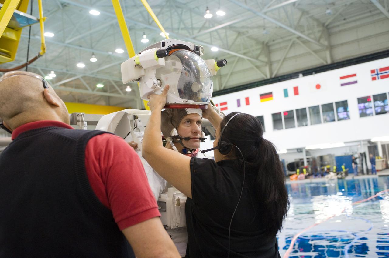Expedition 34 astronaut crew members Chris Hadfield and Tom Marshburn during INC-34/CB ISS EVA 2 91027. Photo Date: December 7, 2011. Location: NBL - Pool Topside. Photographer: Robert Markowitz