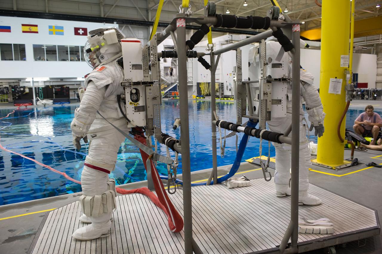 Expedition 34 astronaut crew members Chris Hadfield and Tom Marshburn during INC-34/CB ISS EVA 2 91027. Photo Date: December 7, 2011. Location: NBL - Pool Topside. Photographer: Robert Markowitz