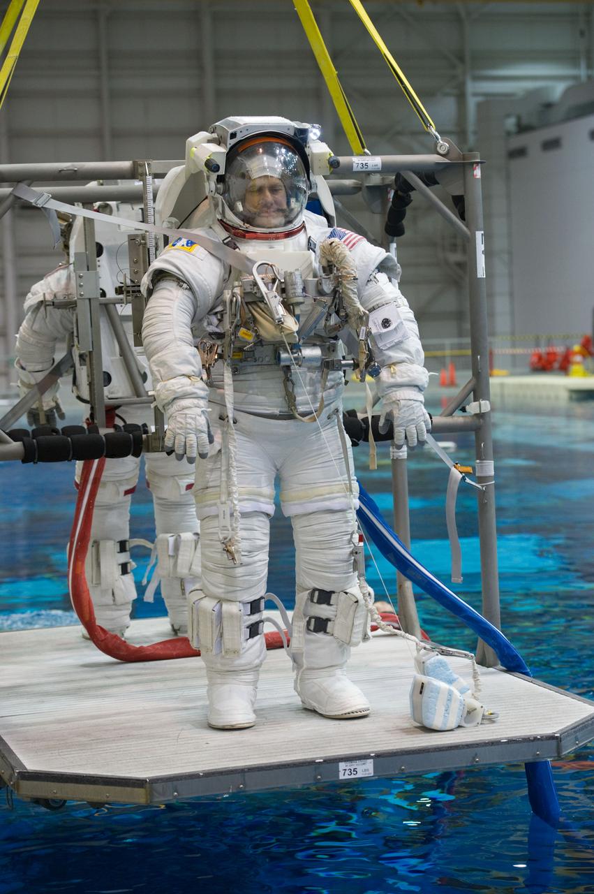 Expedition 34 astronaut crew members Chris Hadfield and Tom Marshburn during INC-34/CB ISS EVA 2 91027. Photo Date: December 7, 2011. Location: NBL - Pool Topside. Photographer: Robert Markowitz