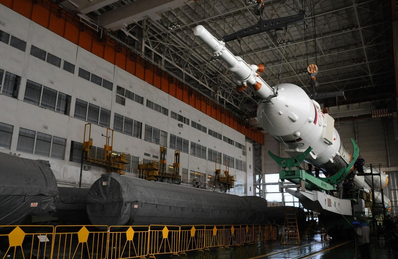 At the Integration Facility at the Baikonur Cosmodrome in Kazakhstan, the upper stage of the Soyuz booster rocket containing the Soyuz TMA-03M spacecraft is mated with the rest of the rocket Dec. 18, 2011. Preparations continue for launch from Baikonur to the International Space Station on Dec. 21 with Expedition 30 Flight Engineer Don Pettit of NASA, Soyuz Commander Oleg Kononenko and Flight Engineer Andre Kuipers of the European Space Agency. Photo credit: NASA