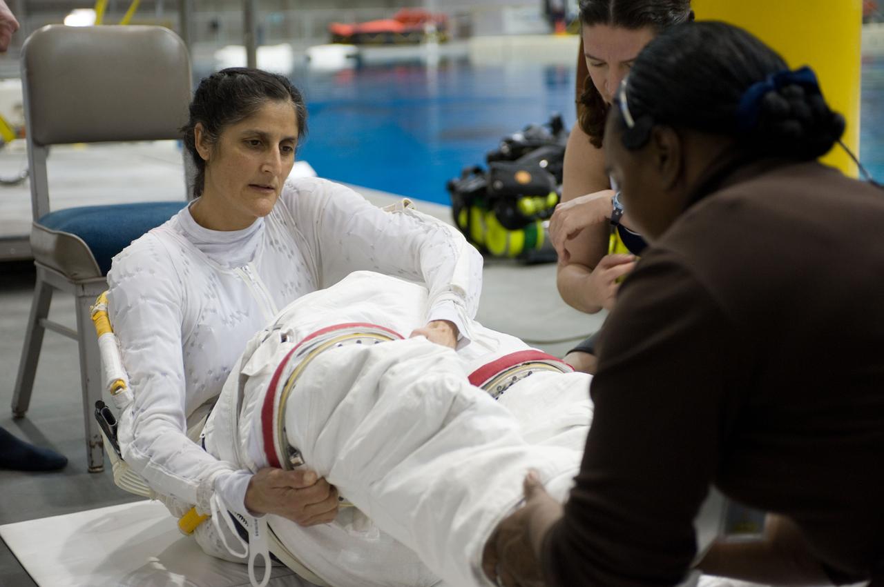 Expedition 33 crew members Sunita Williams and Aki Hoshide during NBL EVA training.  Photo Date: January 11, 2012.  Location: NBL - Pool Topside.  Photographer: Robert Markowitz