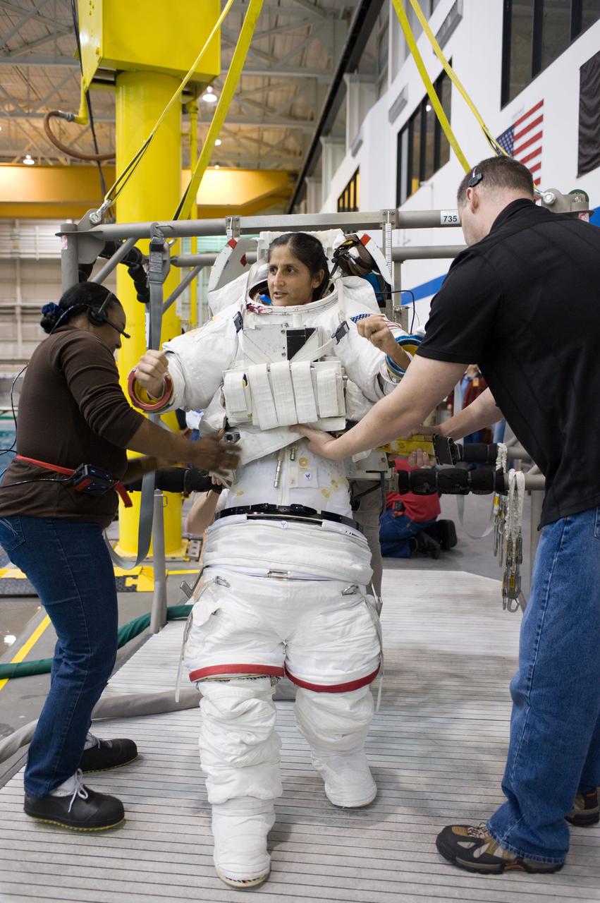 Expedition 33 crew members Sunita Williams and Aki Hoshide during NBL EVA training.  Photo Date: January 11, 2012.  Location: NBL - Pool Topside.  Photographer: Robert Markowitz