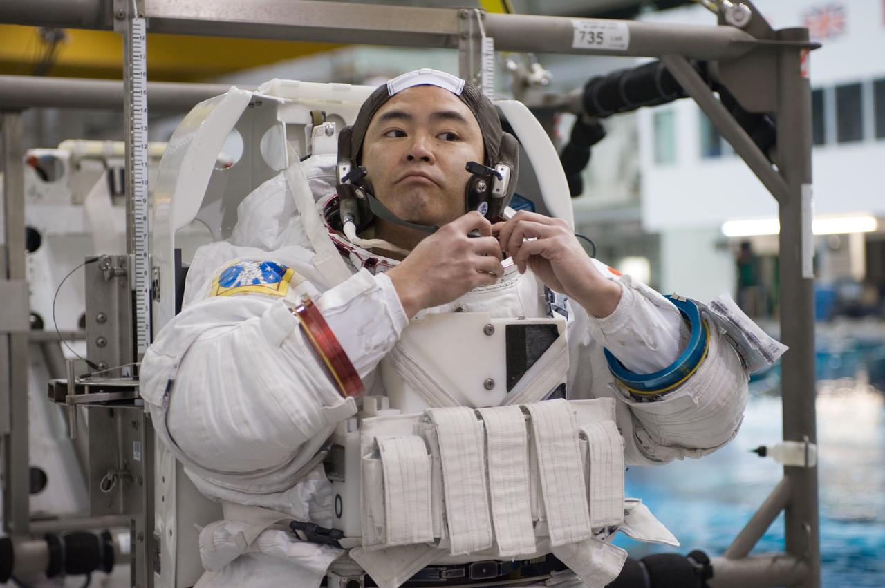 Expedition 33 crew members Sunita Williams and Aki Hoshide during NBL EVA training.  Photo Date: January 11, 2012.  Location: NBL - Pool Topside.  Photographer: Robert Markowitz