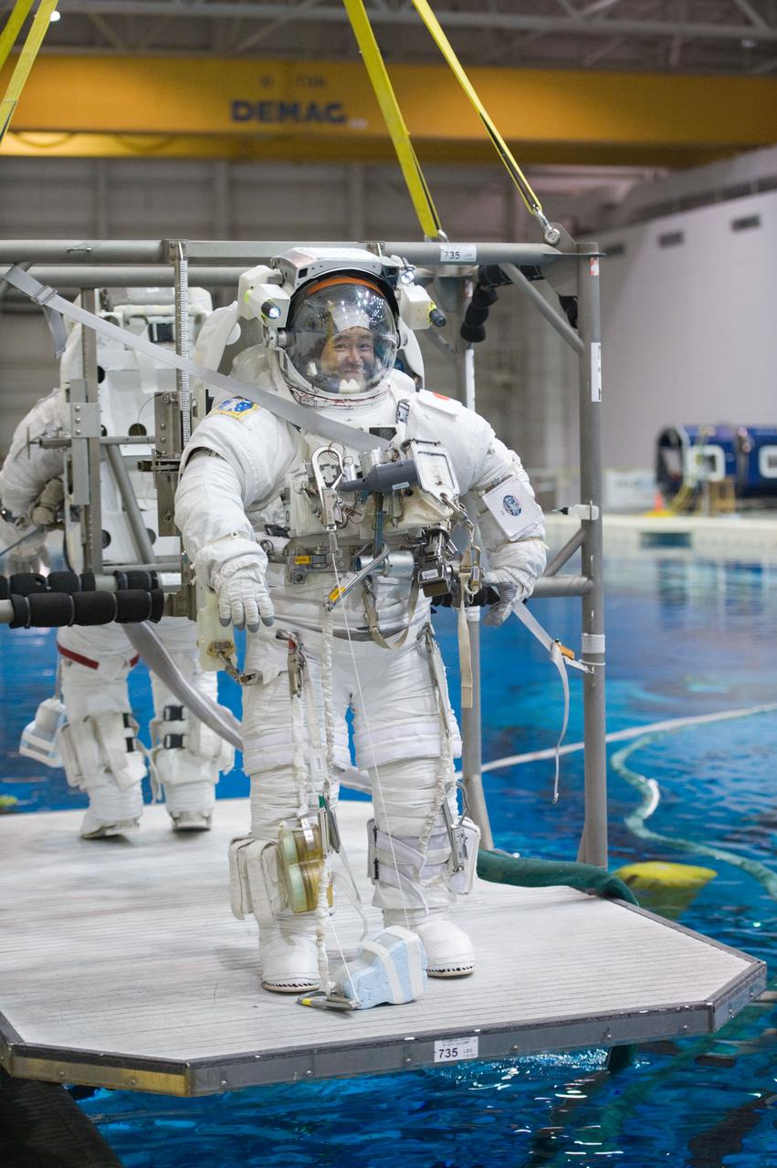 Expedition 33 crew members Sunita Williams and Aki Hoshide during NBL EVA training.  Photo Date: January 11, 2012.  Location: NBL - Pool Topside.  Photographer: Robert Markowitz